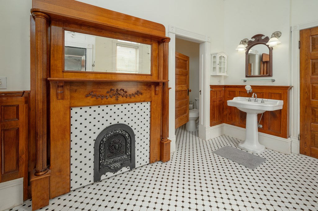 715 Broadway Columbus, GA 31901 - Photo 46 of 75 a living room with a table and a fireplace