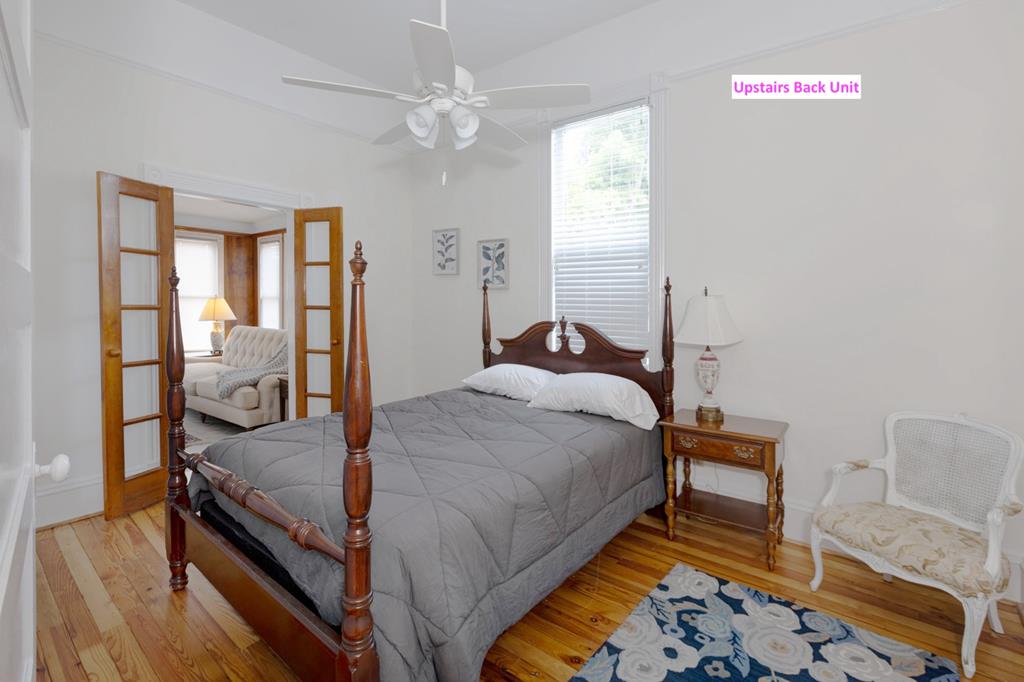 715 Broadway Columbus, GA 31901 - Photo 63 of 75 a bedroom with a bed and wooden floor