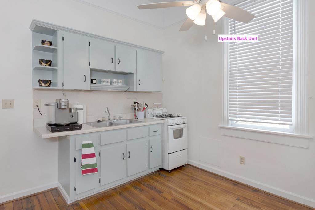 715 Broadway Columbus, GA 31901 - Photo 68 of 75 a kitchen with cabinets appliances and a window