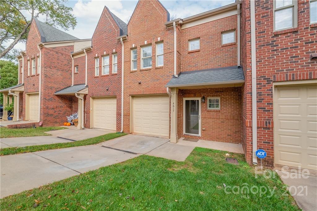 4617 Dabney Vigor Drive Charlotte, NC 28209 - Photo 1 of 23 a view of a brick house with a yard plants and large tree