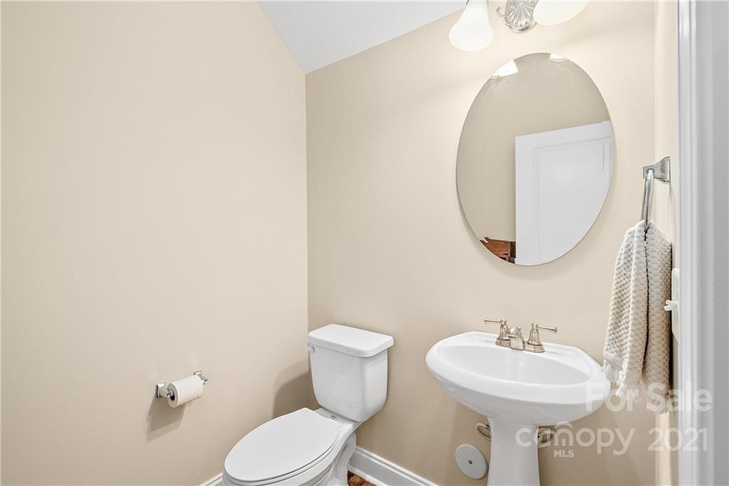 4617 Dabney Vigor Drive Charlotte, NC 28209 - Photo 11 of 23 a bathroom with a sink mirror and toilet