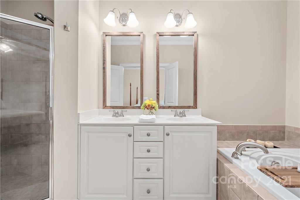 4617 Dabney Vigor Drive Charlotte, NC 28209 - Photo 13 of 23 a bathroom with a sink and a mirror