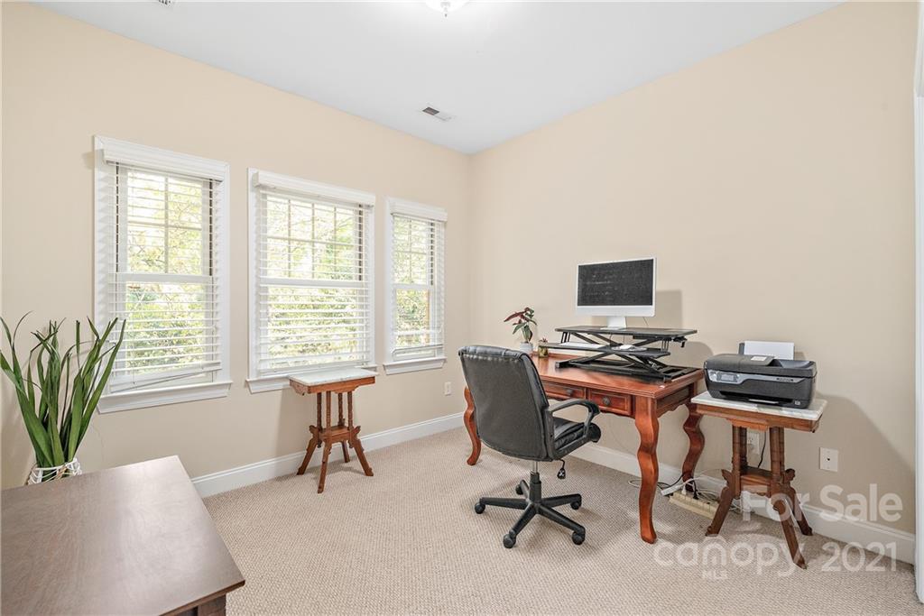 4617 Dabney Vigor Drive Charlotte, NC 28209 - Photo 15 of 23 a view of a workspace with furniture and a window
