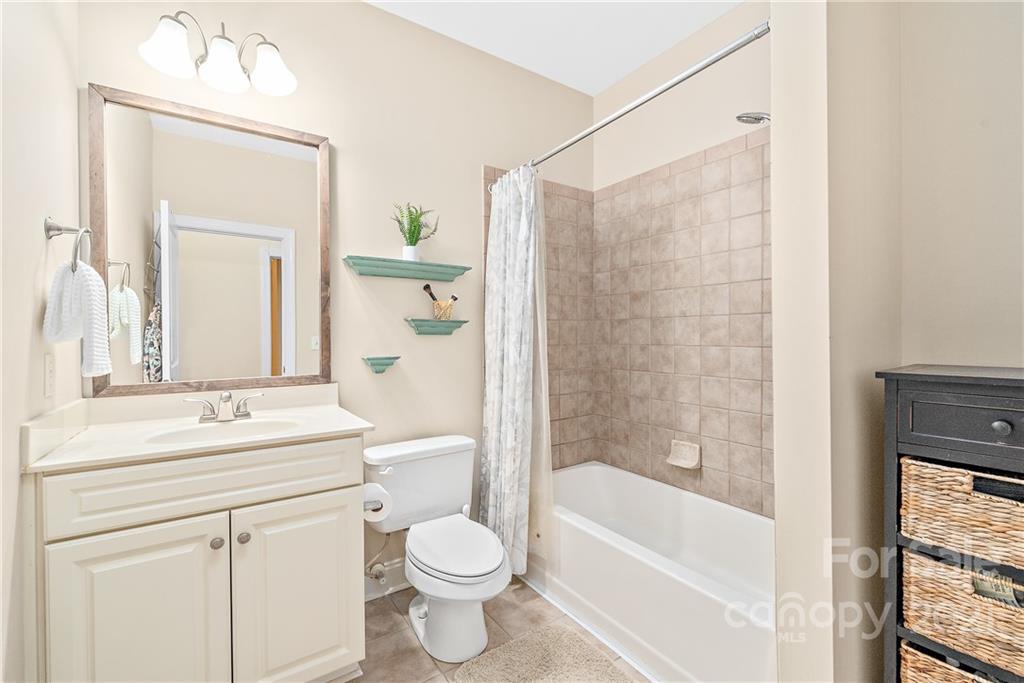 4617 Dabney Vigor Drive Charlotte, NC 28209 - Photo 16 of 23 a bathroom with a sink a toilet and shower