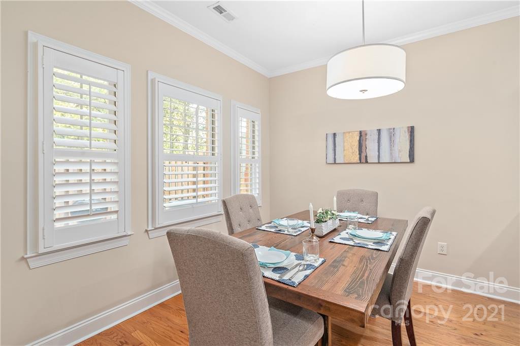 4617 Dabney Vigor Drive Charlotte, NC 28209 - Photo 7 of 23 a view of a dining room with furniture window and wooden floor