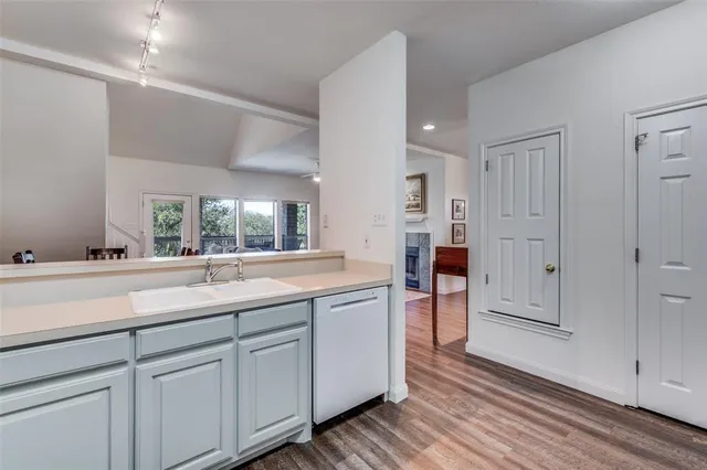 a kitchen with a sink and cabinets
