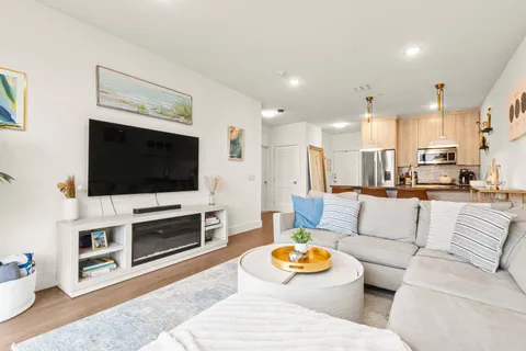 a stove top oven sitting inside of a kitchen