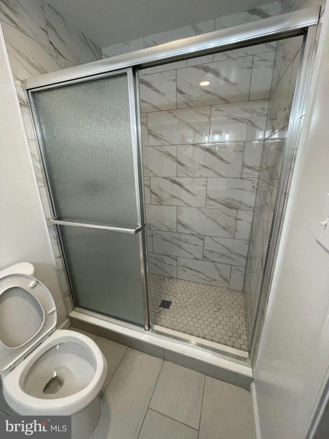 2016 Gatewood Place Silver Spring, MD 20903 - Photo 17 of 24 a bathroom with a shower and toilet