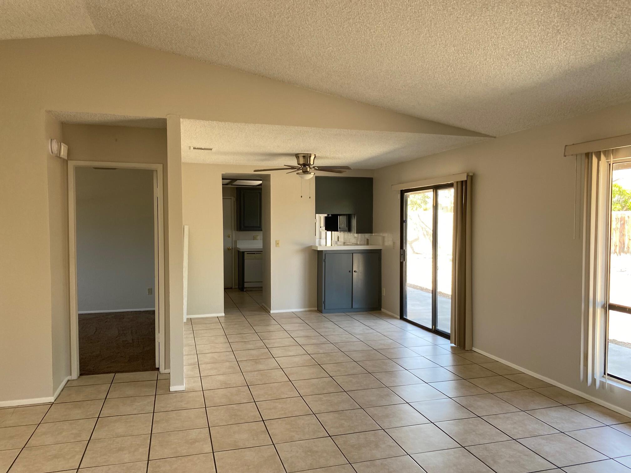 2120 Wayne Road Palm Springs, CA 92262 - Photo 3 of 21 a view of a kitchen with an entryway and a window