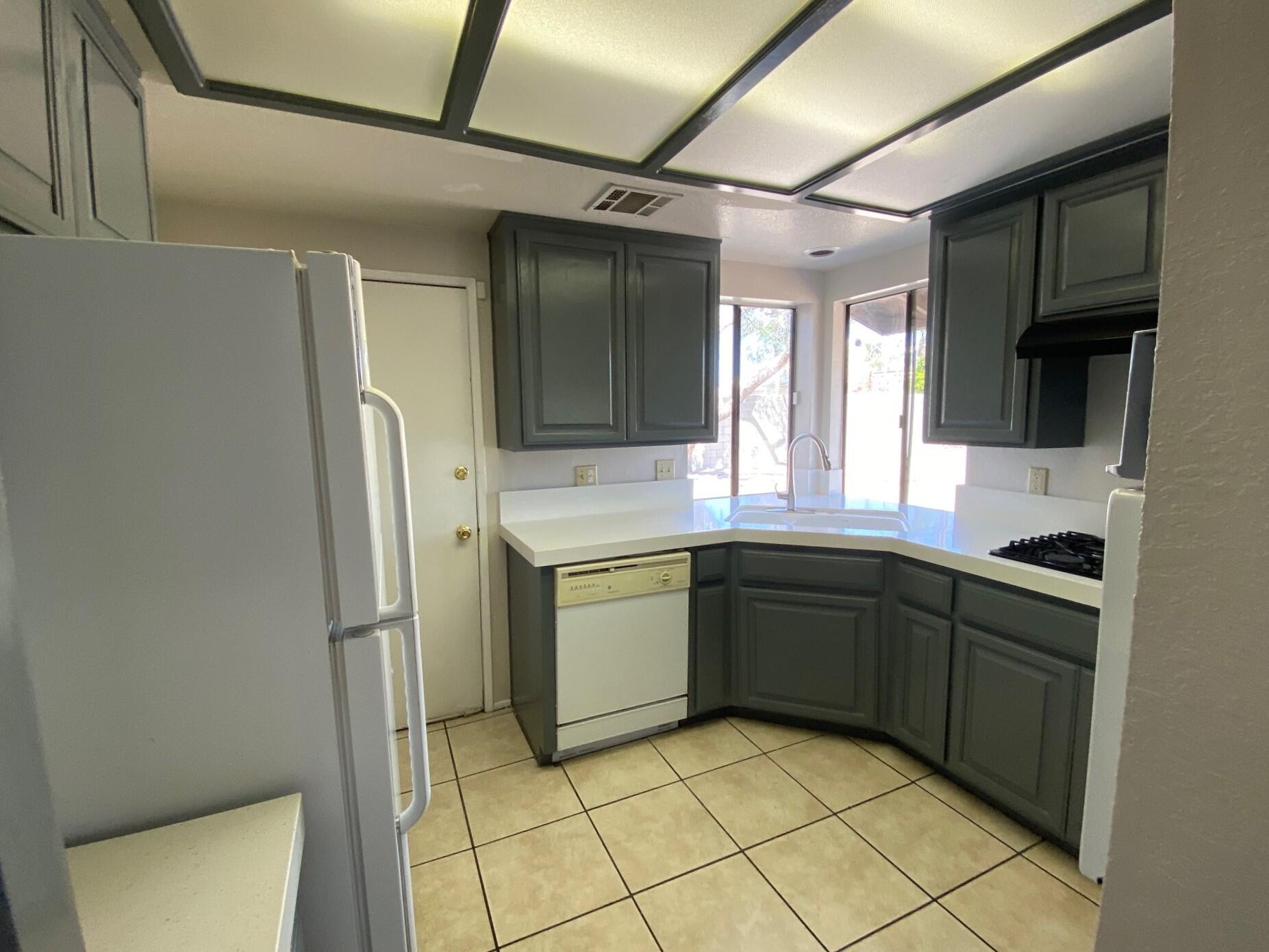 2120 Wayne Road Palm Springs, CA 92262 - Photo 8 of 21 a kitchen with a sink cabinets and appliances