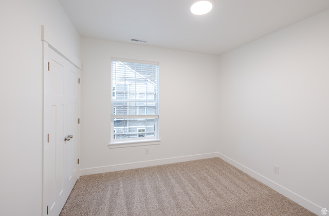 4661 Poplar Way, Unit R301 Mapleton, UT 84664 - Photo 7 of 17 Unfurnished bedroom featuring a closet and light carpet