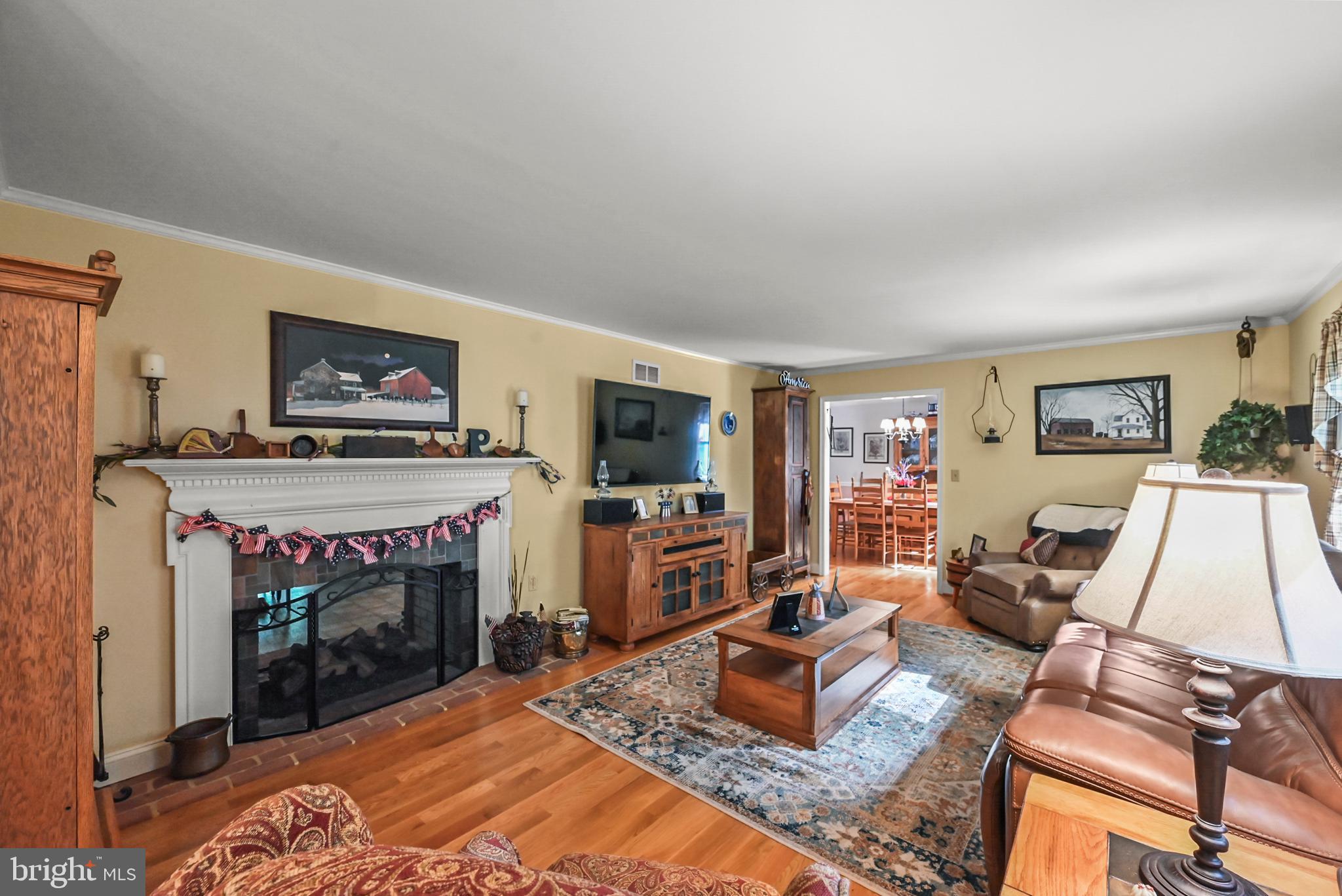 961 Beaver Creek Road Hanover, PA 17331 - Photo 19 of 52 a living room with furniture a flat screen tv and a fireplace