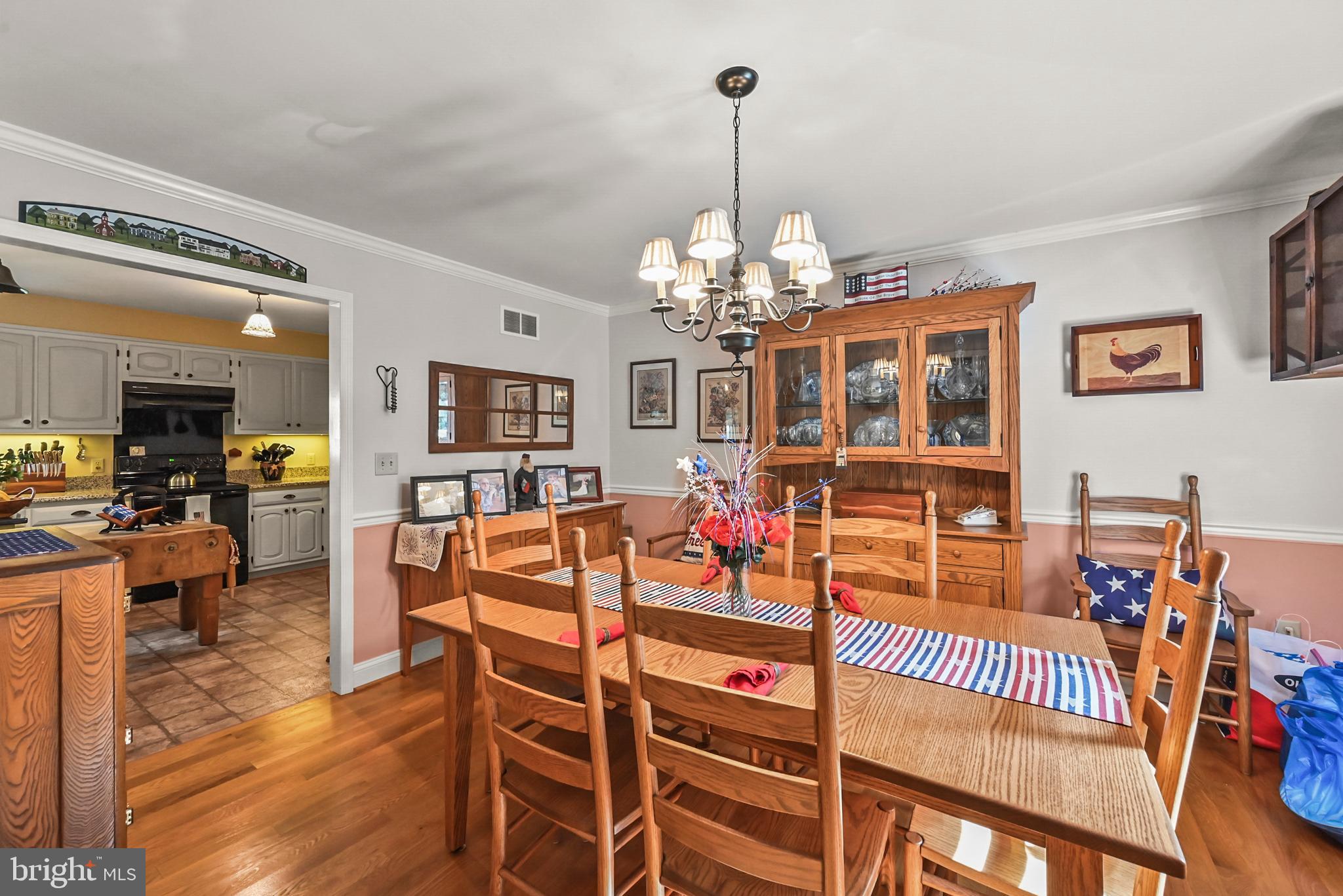 961 Beaver Creek Road Hanover, PA 17331 - Photo 22 of 52 a view of a dining room with furniture and wooden floor