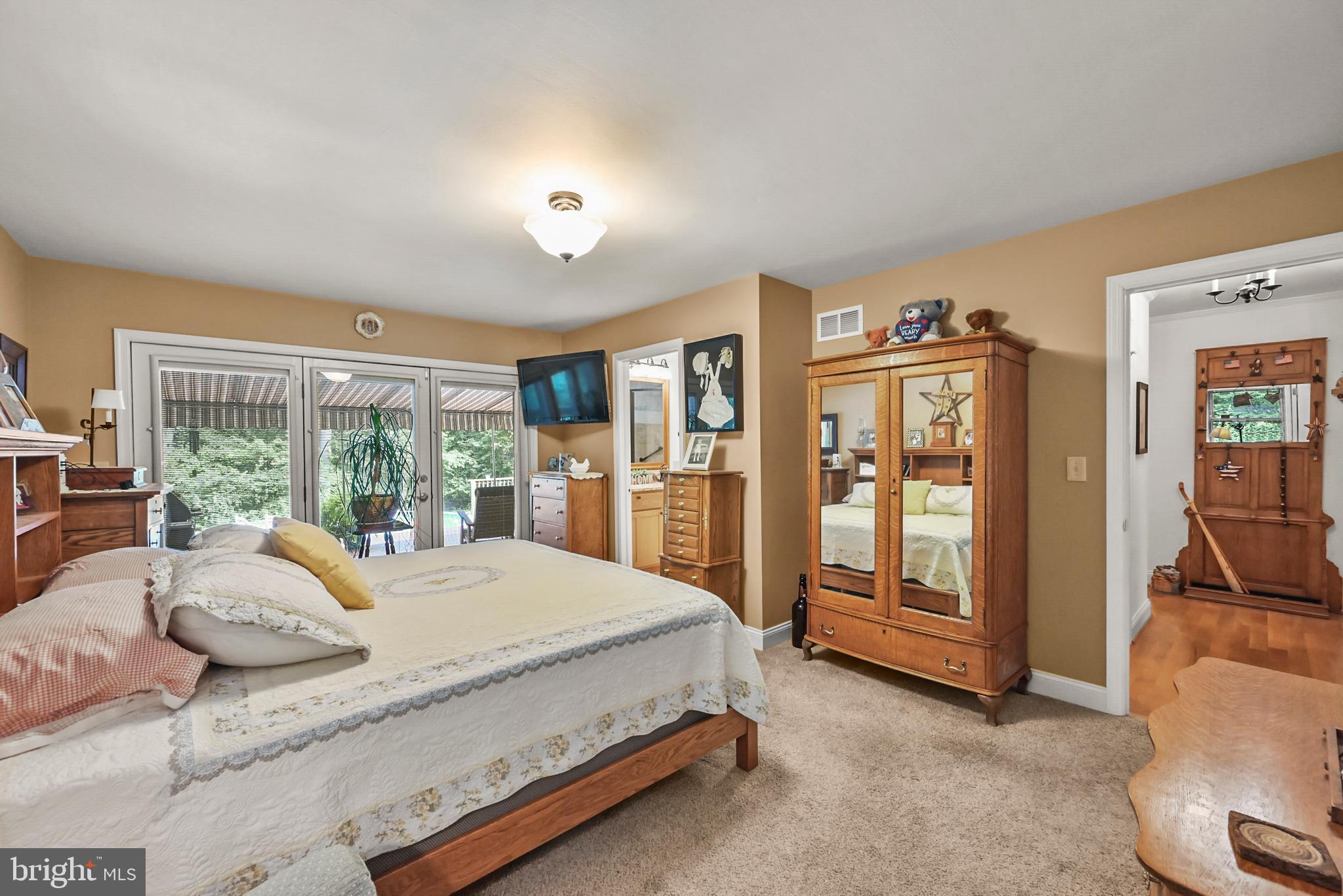 961 Beaver Creek Road Hanover, PA 17331 - Photo 30 of 52 a spacious bedroom with a large bed and a large window
