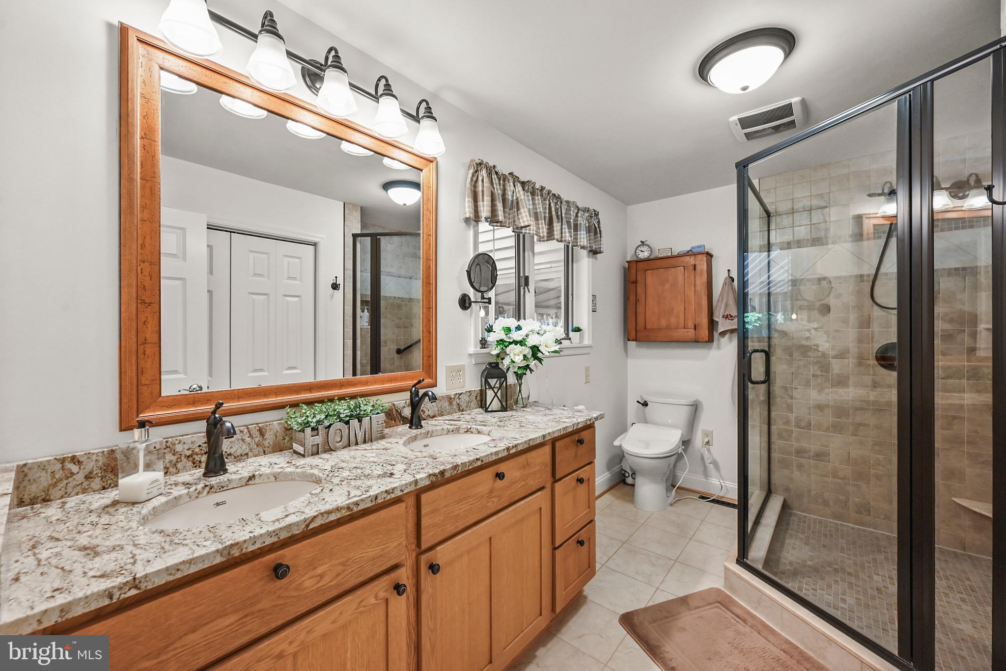 961 Beaver Creek Road Hanover, PA 17331 - Photo 32 of 52 a bathroom with a granite countertop sink mirror and shower