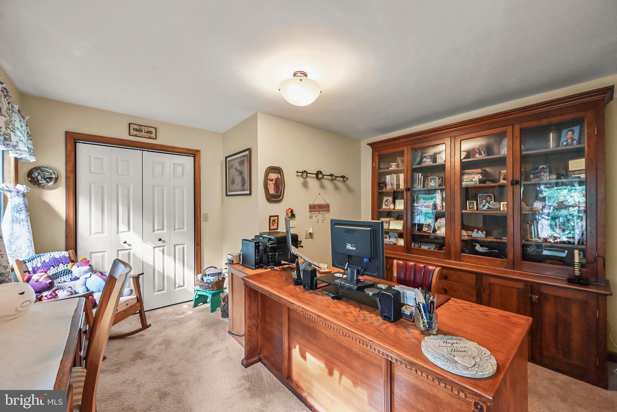 961 Beaver Creek Road Hanover, PA 17331 - Photo 33 of 52 a room with furniture a flat screen tv and a window