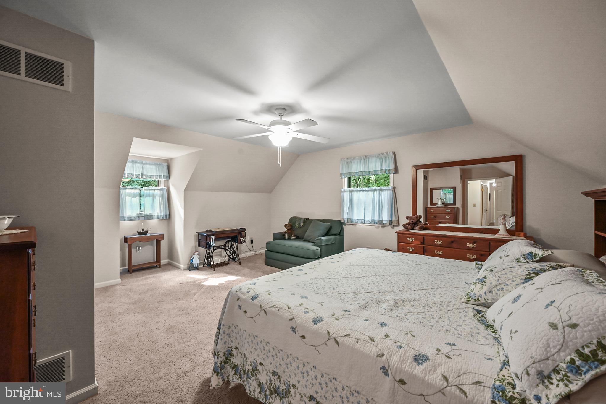 961 Beaver Creek Road Hanover, PA 17331 - Photo 35 of 52 a bedroom with a large bed a chandelier and dresser