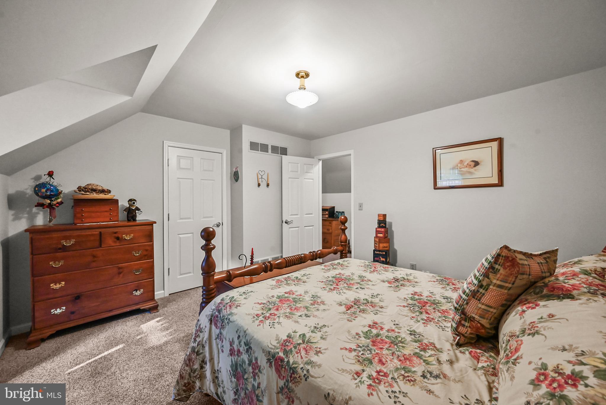 961 Beaver Creek Road Hanover, PA 17331 - Photo 38 of 52 a bedroom with a bed and a chandelier