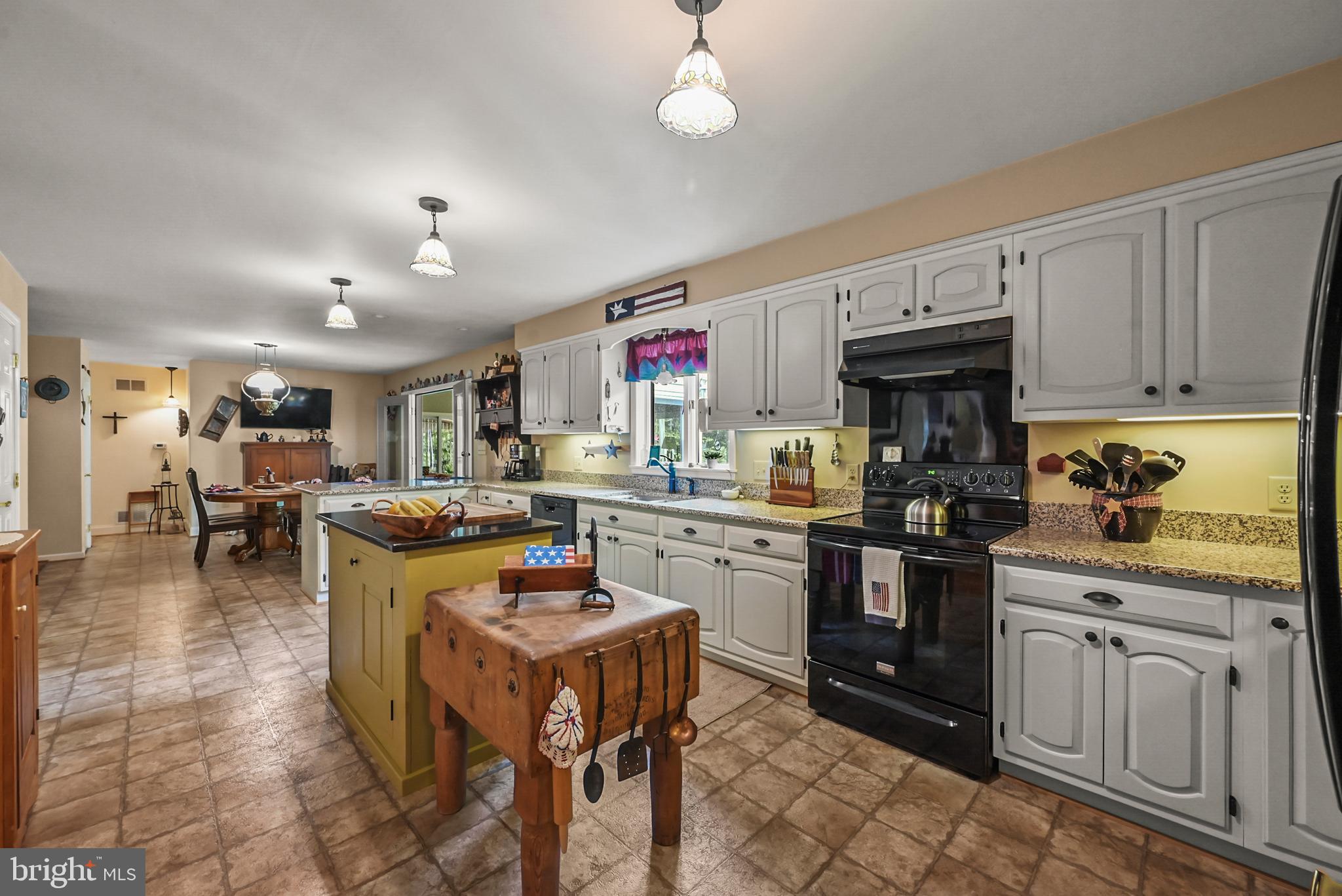 961 Beaver Creek Road Hanover, PA 17331 - Photo 9 of 52 a kitchen with kitchen island granite countertop lots of counter top space and stainless steel appliances