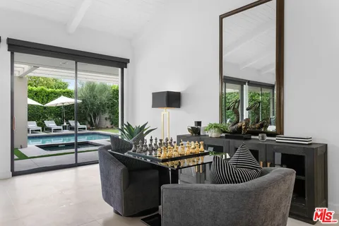 a kitchen with stainless steel appliances kitchen island granite countertop a sink and cabinets