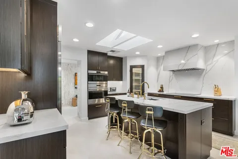 a bathroom with a double vanity sink a mirror and a shower