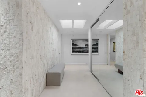 a bed room with a bed and a chandelier