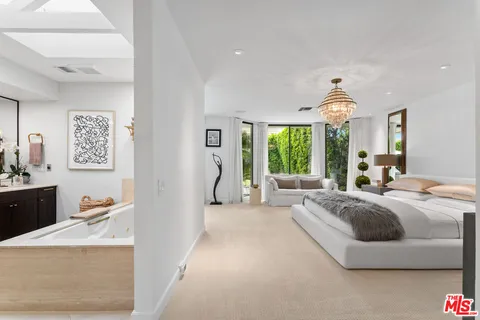 a utility room with sink dryer and washer