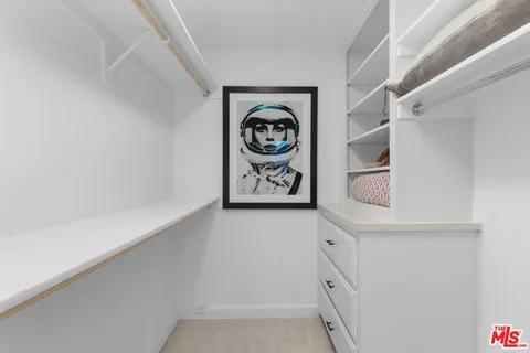 a view of a patio with table and chairs potted plants with wooden floor
