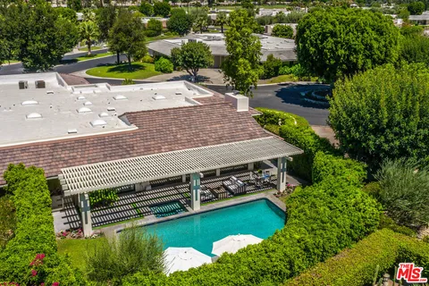 a view of swimming pool with seating area and furniture