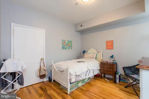 a bedroom with a bed and a table in it