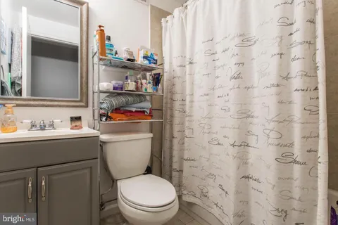 a bathroom with a toilet and a sink