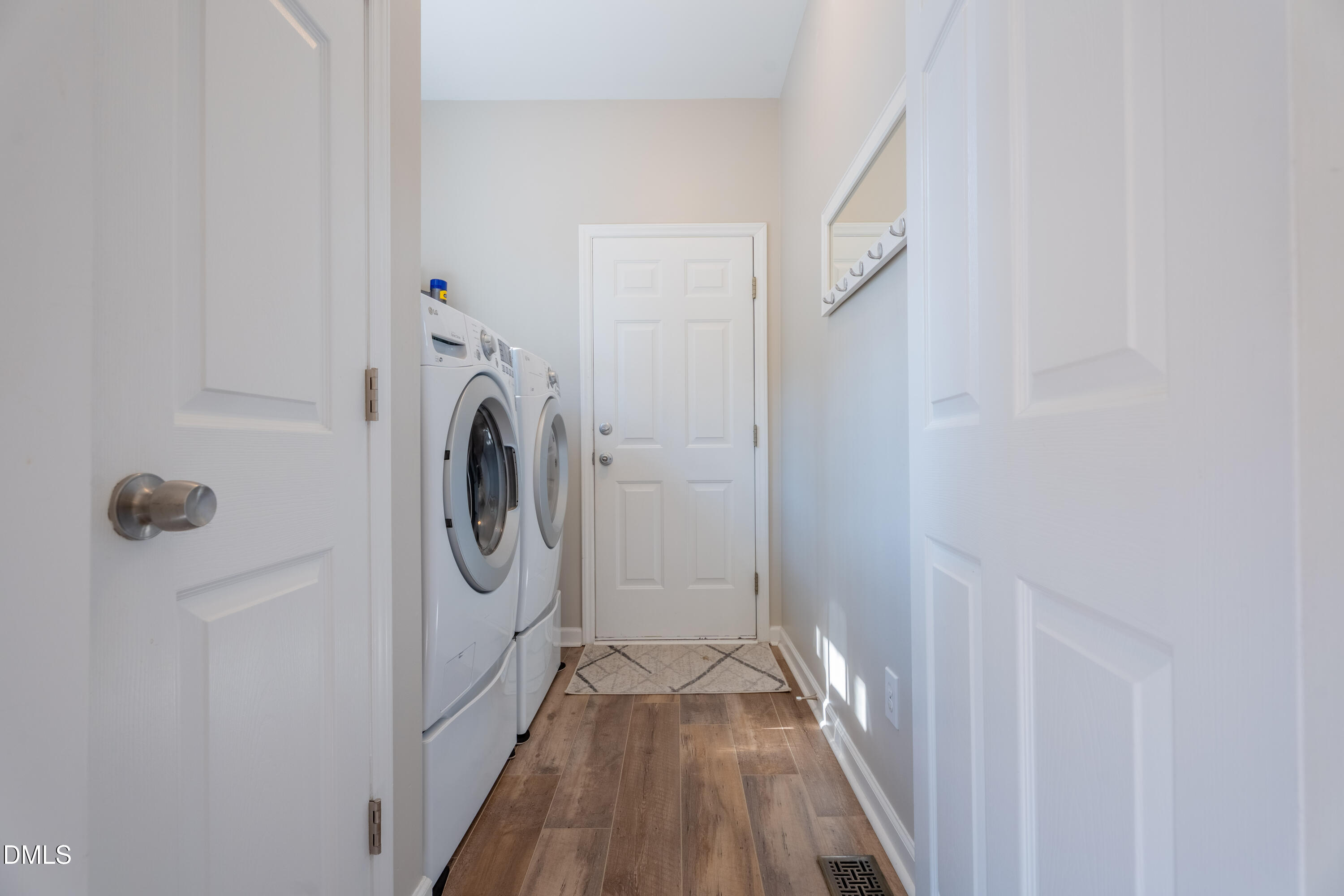 1305 Olde Walker Mill Road Apex, NC 27502 - Photo 15 of 41 a view of a hallway with washer and dryer