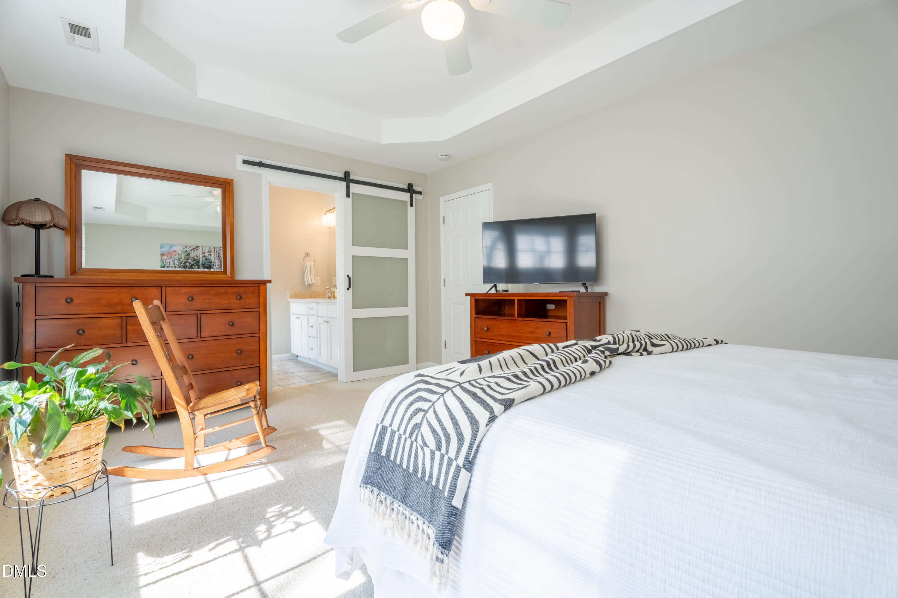 1305 Olde Walker Mill Road Apex, NC 27502 - Photo 18 of 41 a bedroom with a bed and a potted plant