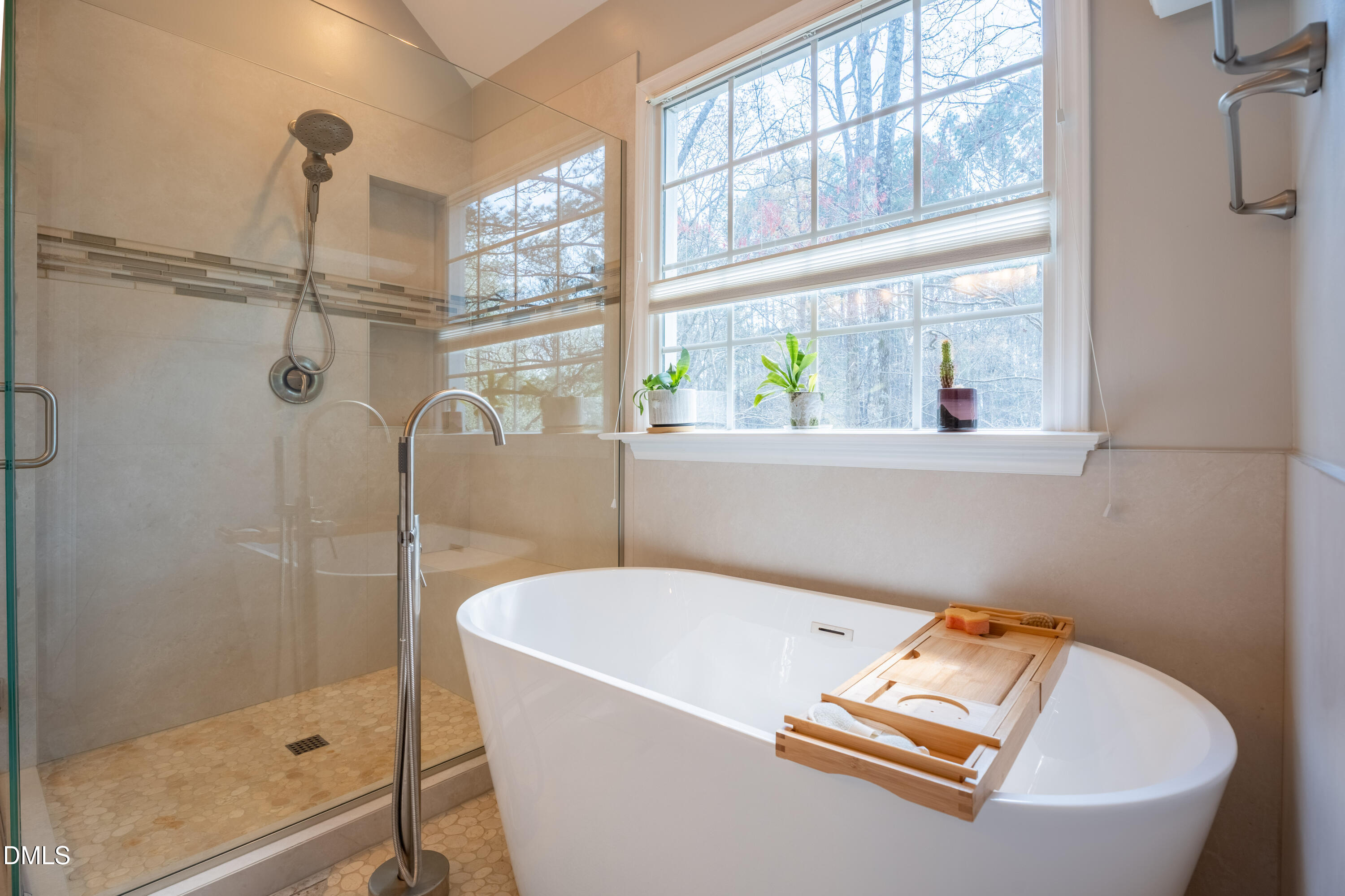 1305 Olde Walker Mill Road Apex, NC 27502 - Photo 22 of 41 a bathroom with a tub and a shower