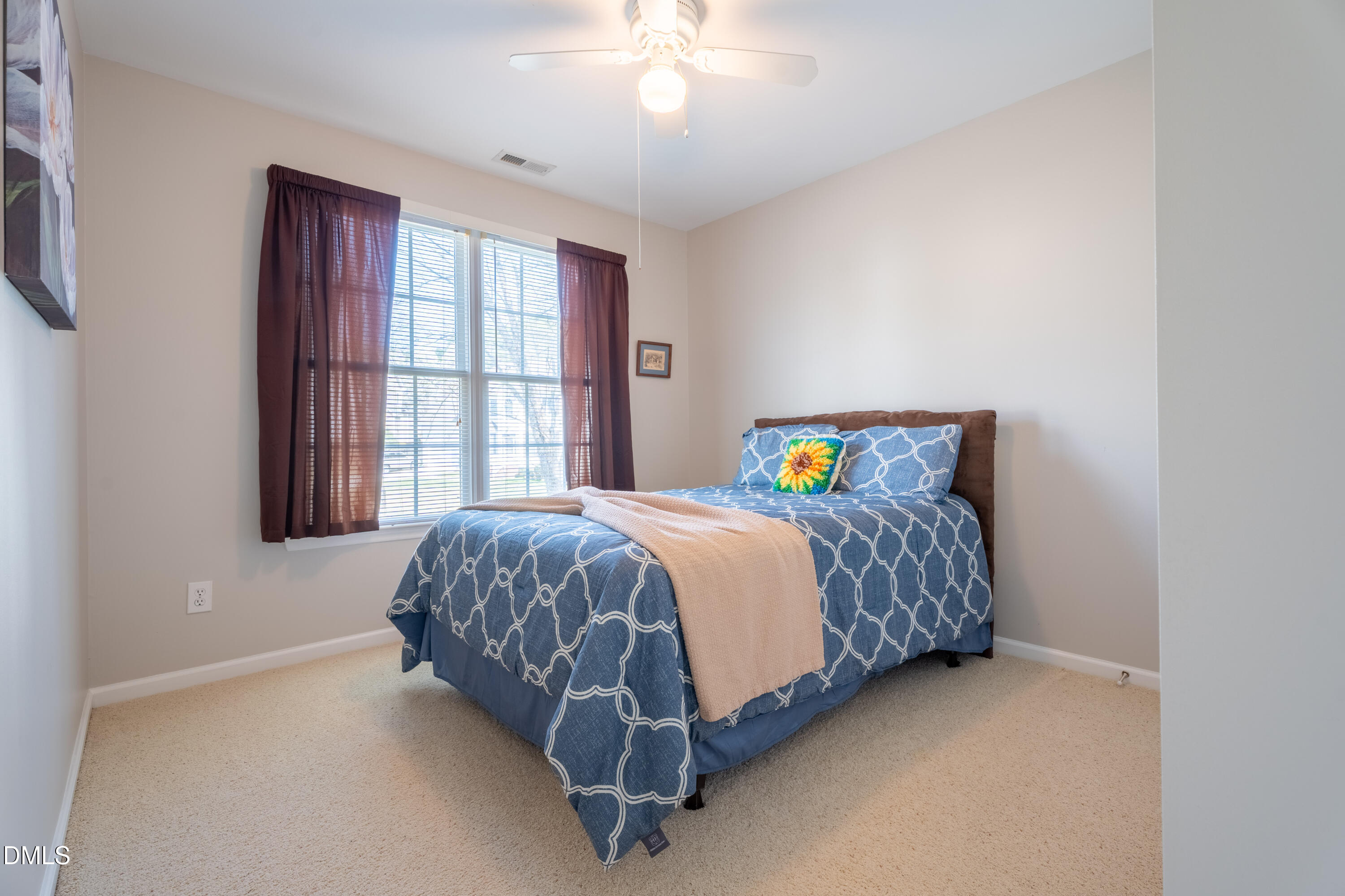 1305 Olde Walker Mill Road Apex, NC 27502 - Photo 24 of 41 a spacious bedroom with a bed and a window