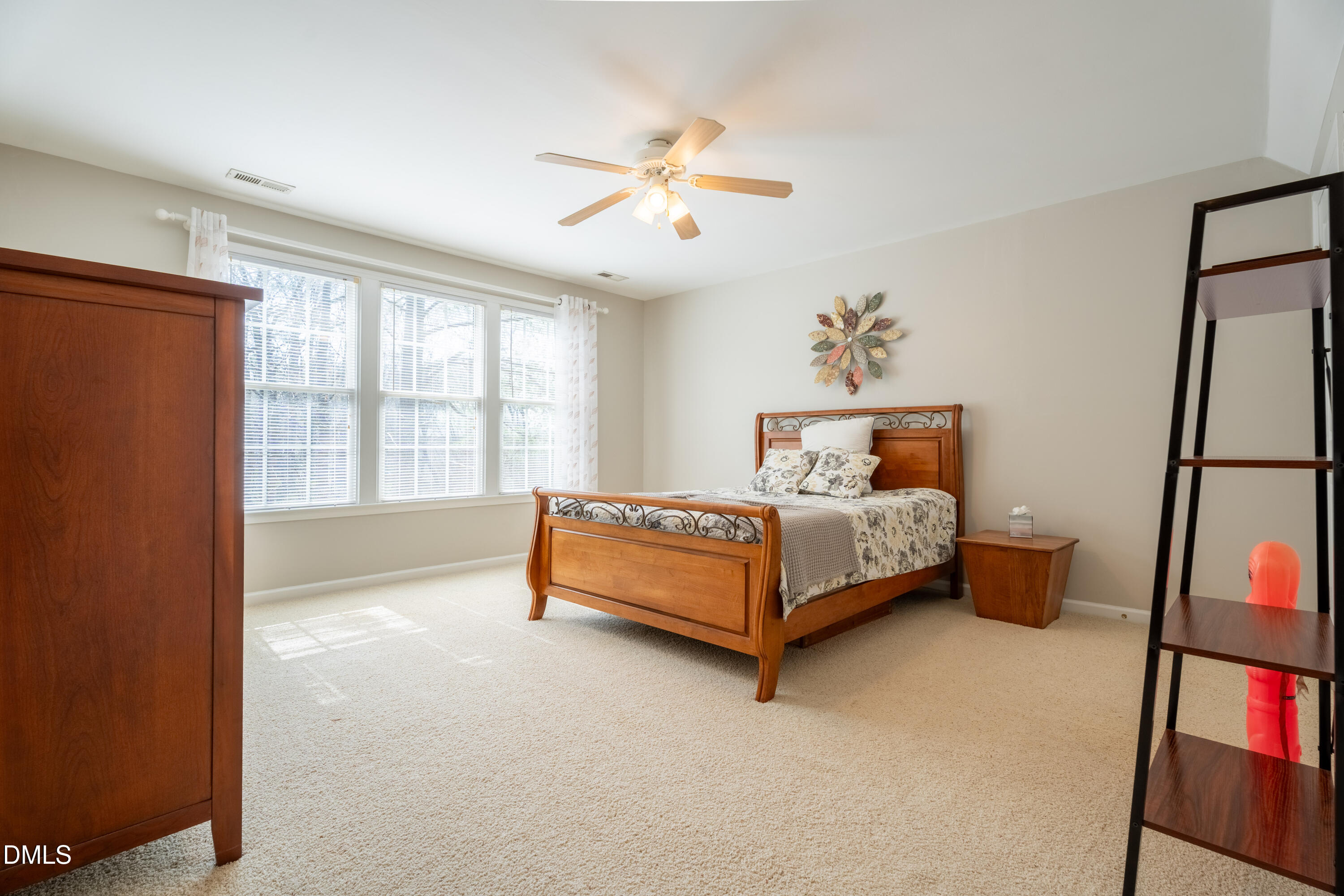 1305 Olde Walker Mill Road Apex, NC 27502 - Photo 29 of 41 a bedroom with a bed and a large window