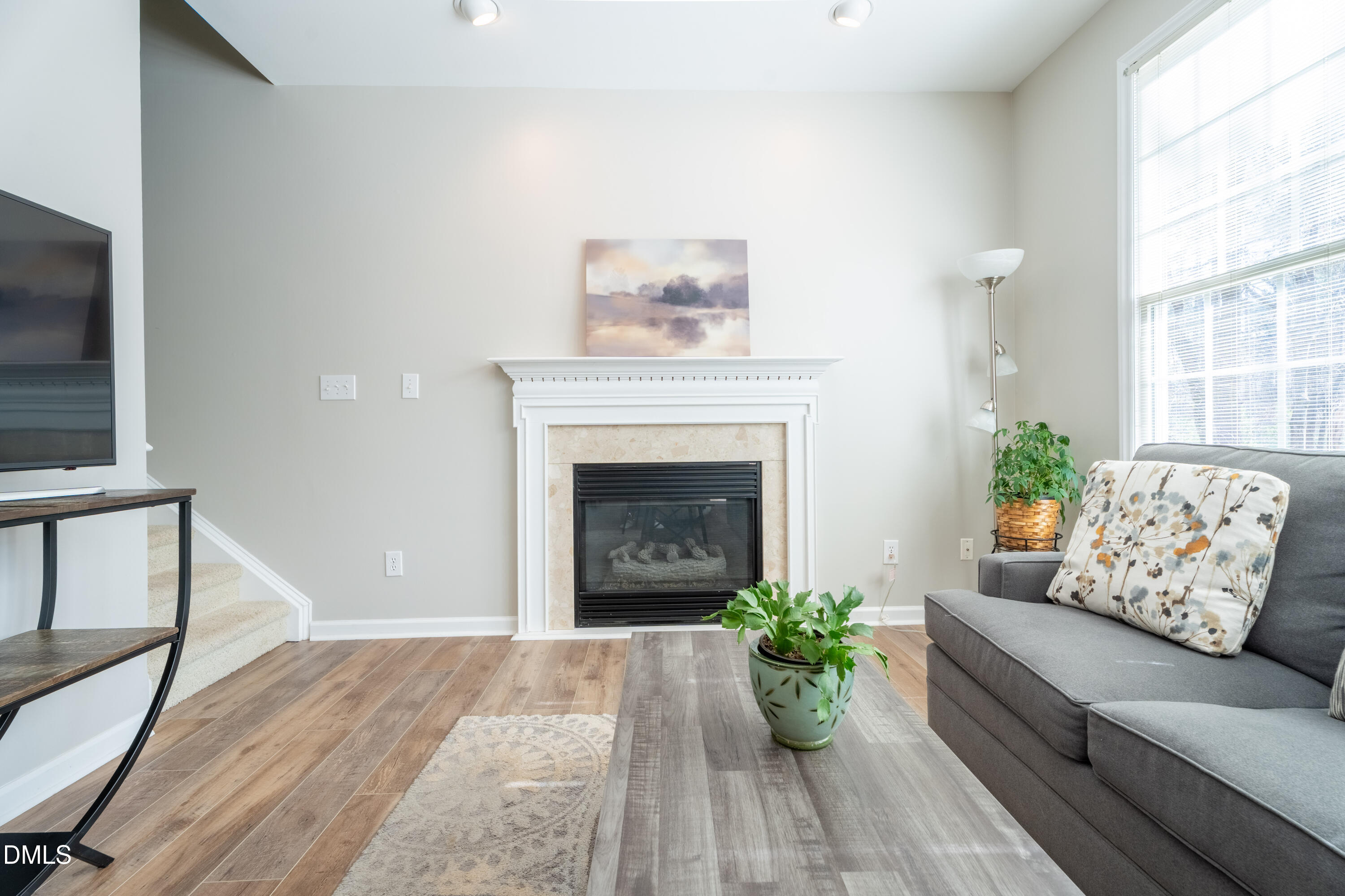 1305 Olde Walker Mill Road Apex, NC 27502 - Photo 31 of 41 a living room with furniture and a fireplace