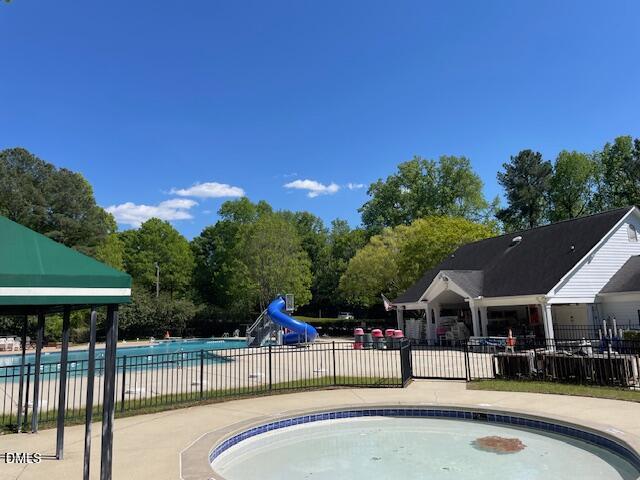 1305 Olde Walker Mill Road Apex, NC 27502 - Photo 39 of 41 a view of a swimming pool with a patio