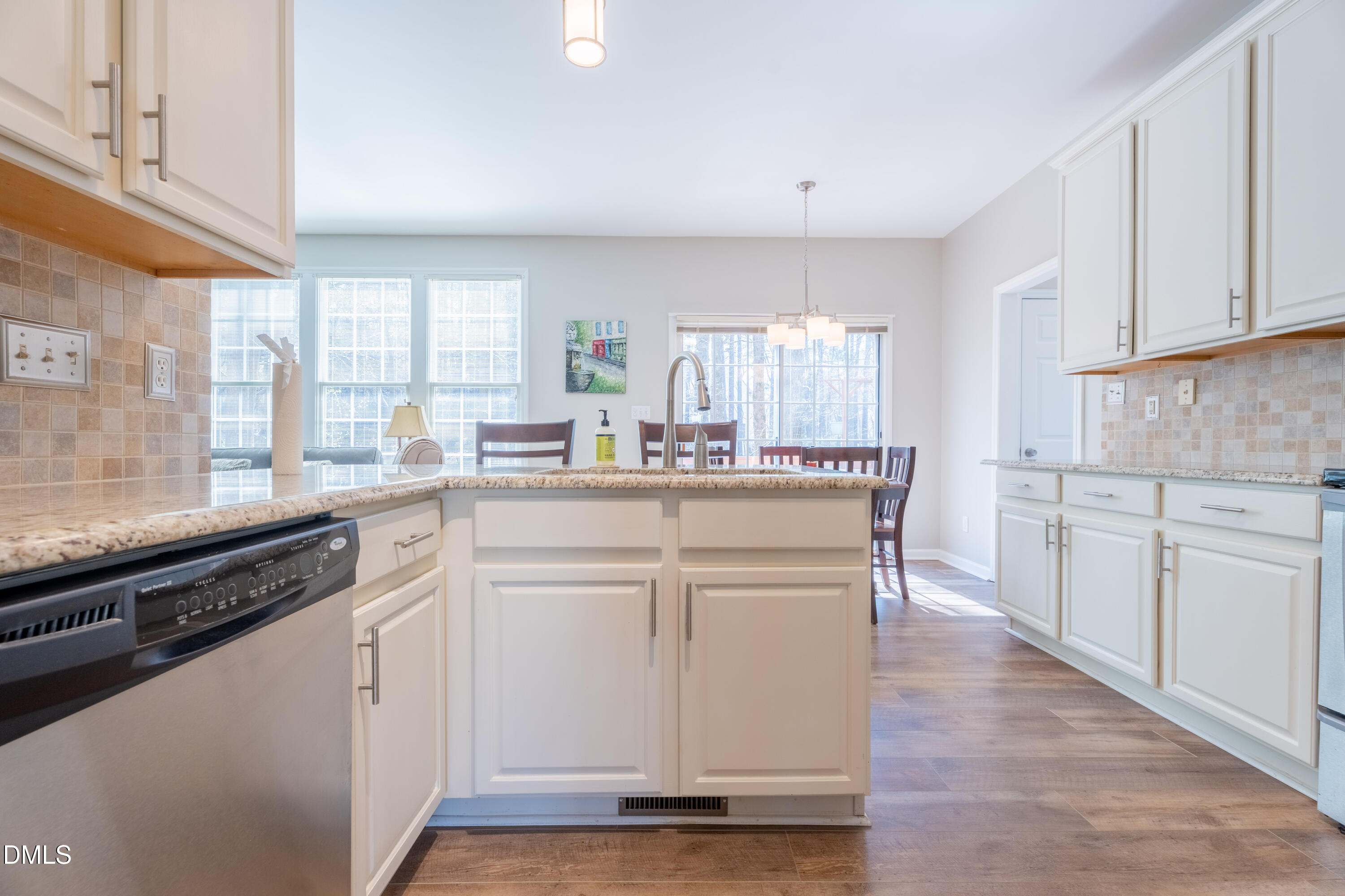 1305 Olde Walker Mill Road Apex, NC 27502 - Photo 7 of 41 a kitchen with white cabinets and white appliances