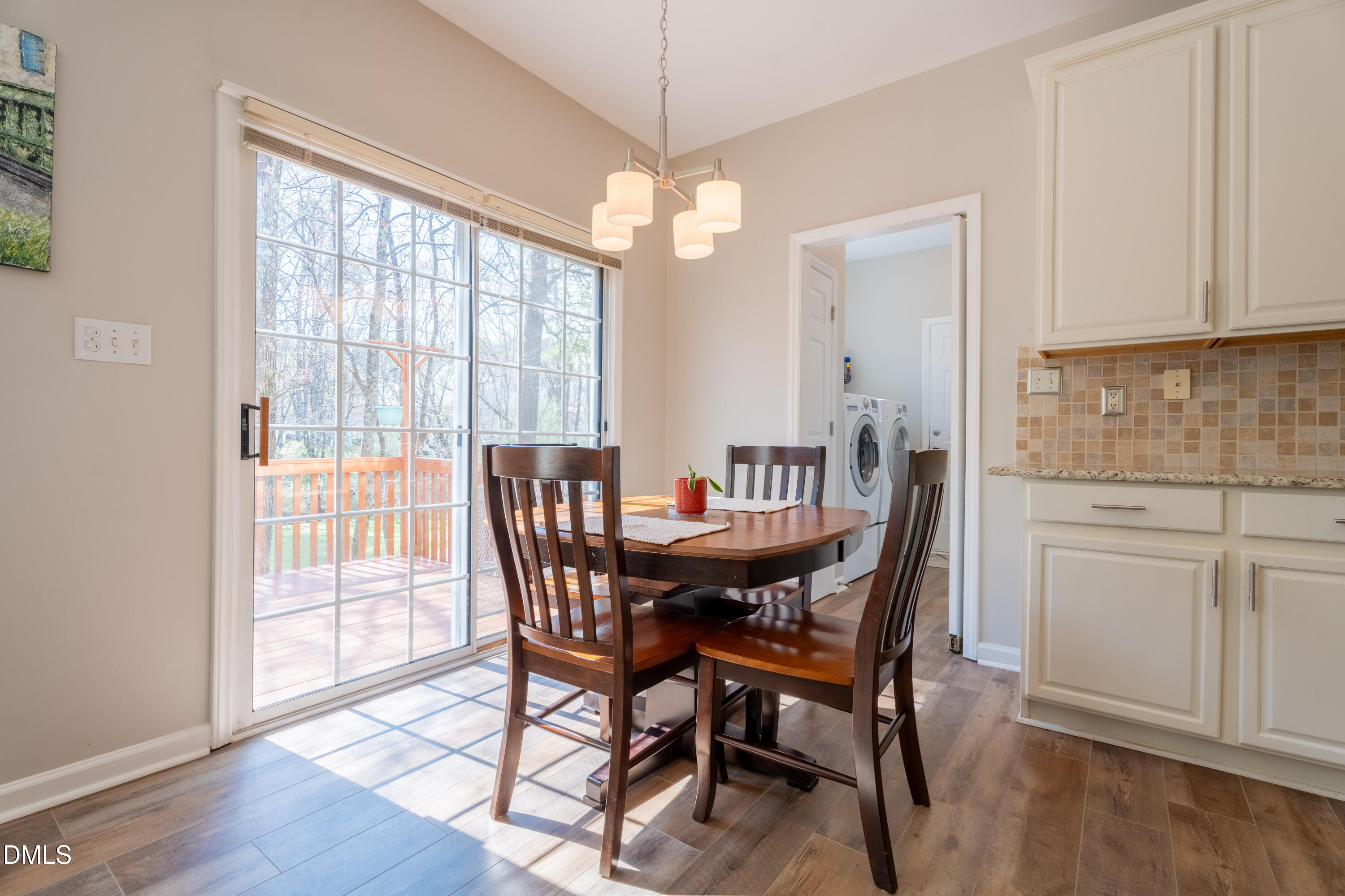 1305 Olde Walker Mill Road Apex, NC 27502 - Photo 8 of 41 a view of a dining room with furniture window and wooden floor