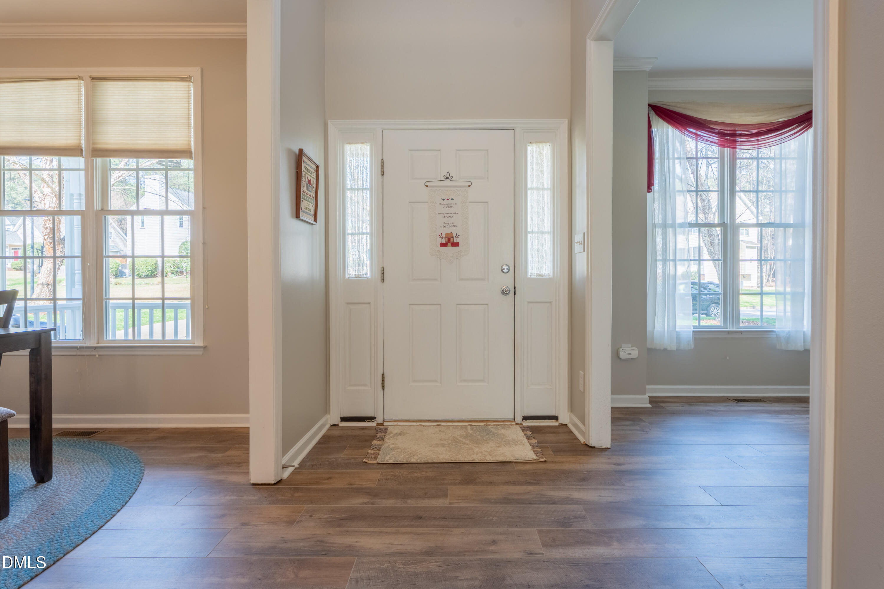 1305 Olde Walker Mill Road Apex, NC 27502 - Photo 9 of 41 an empty room with wooden floor and windows