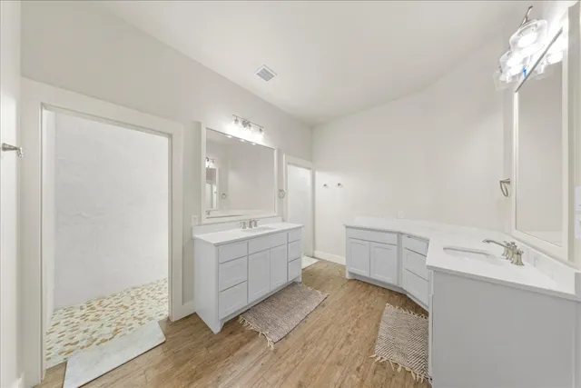 a white toilet sitting next to a white wall