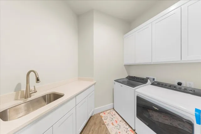 a kitchen with kitchen island a table and chairs