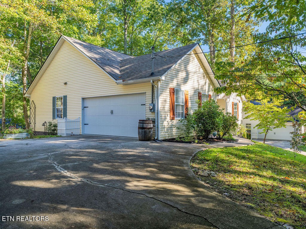 170 Cedar Circle Powell, TN 37849 - Photo 23 of 27 a view of a house with a yard and garage