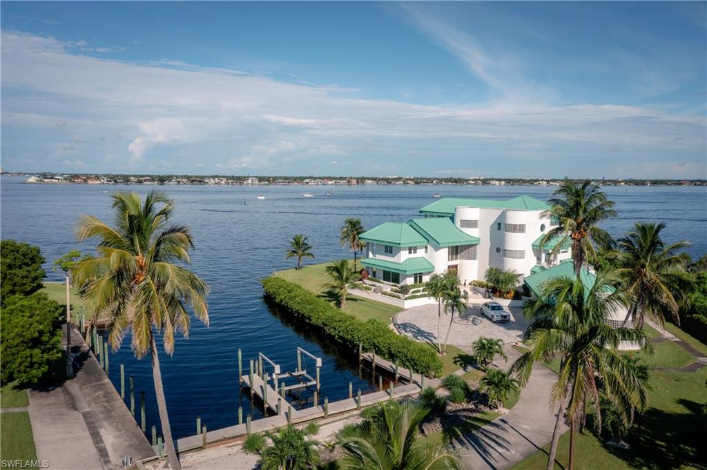 14040 Schultz Road Fort Myers, FL 33908 - Photo 44 of 48 Water view featuring boat lift and a dock