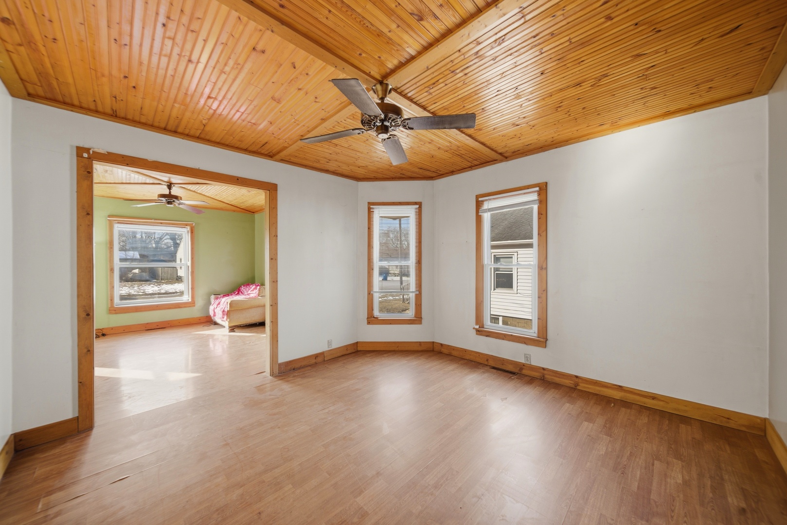 1507 West 9th Street Dixon, IL 61021 - Photo 7 of 22 a view of an empty room with a window and wooden floor