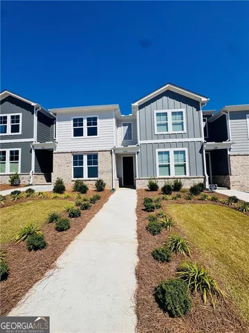 a front view of a house with swimming pool