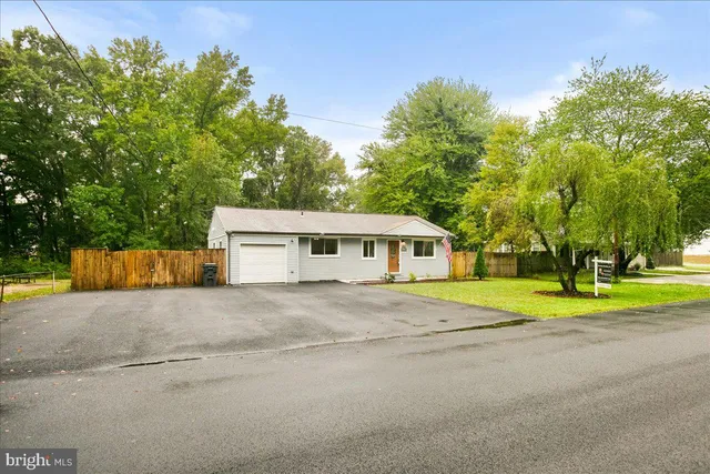 a big house with trees in front of it