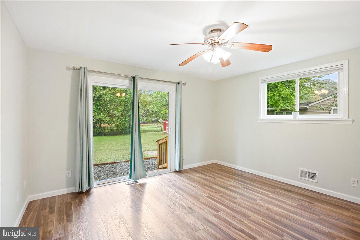 2809 Shiloh Church Road Bryans Road, MD 20616 - Photo 11 of 21 a view of a livingroom with a ceiling fan and window