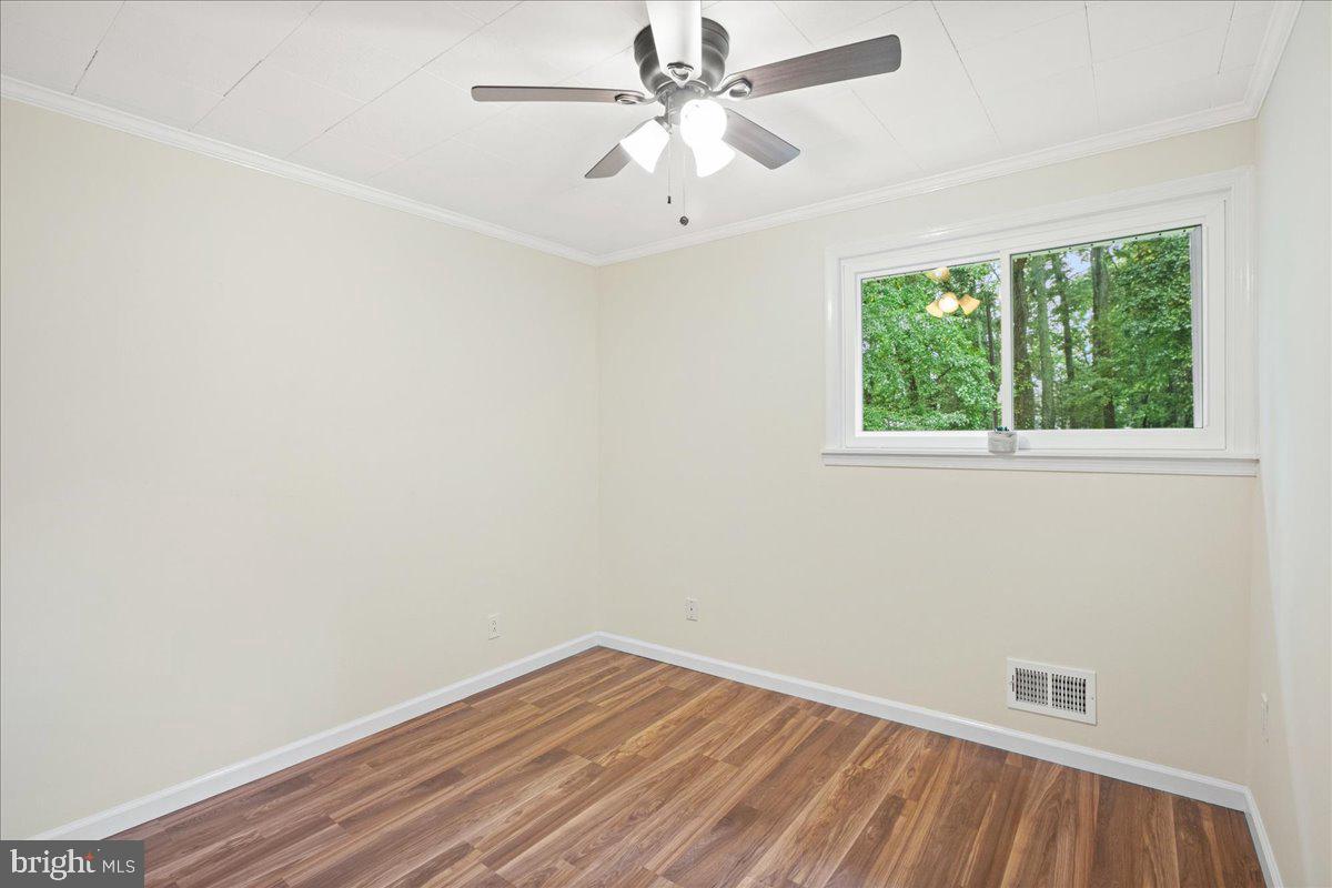 2809 Shiloh Church Road Bryans Road, MD 20616 - Photo 15 of 21 an empty room with a window and wooden floor